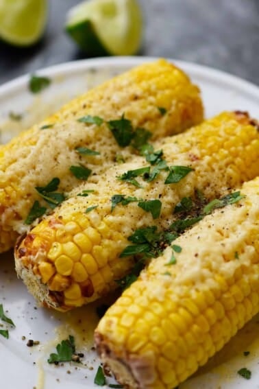 Air Fryer Mexican Street Corn Recipe - This flavorful, super easy Mexican Street Corn recipe is ready in 15 minutes in the air fryer and always a favorite! // addapinch.com