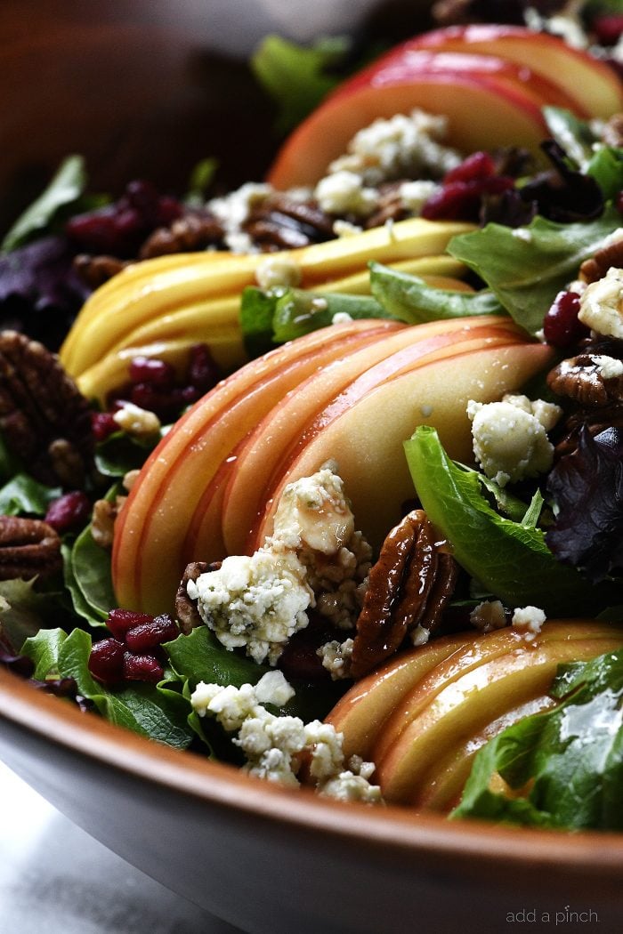 Apple Pear Salad with Pomegranate Vinaigrette with pomegranate arils, blue cheese and roasted nuts - addapinch.com