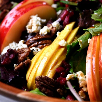 Apple Pear Salad Recipe - This Apple Pear Salad with Pomegranate Vinaigrette makes a delicious salad anytime of year, but especially throughout the holidays. // addapinch.com