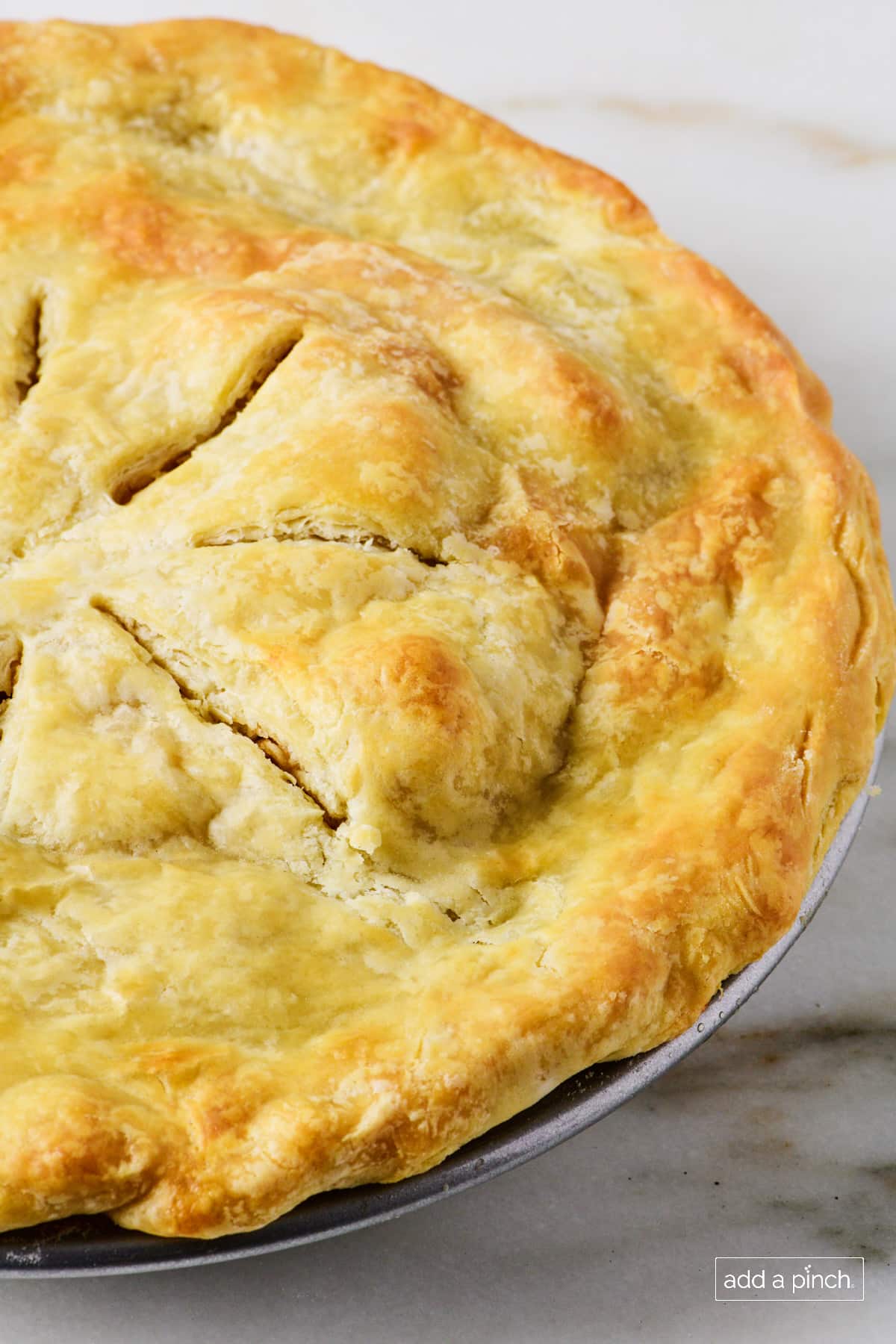 Baked apple pie with flaky, golden top crust.