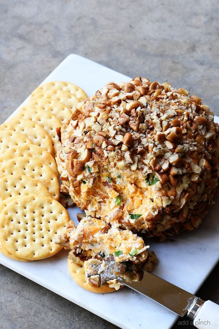 Bacon Ranch Cheese Ball Recipe - This creamy, dreamy cheese ball melds together bacon, ranch seasoning, and is the encased in chopped pecans. Perfect for easy entertaining! // addapinch.com