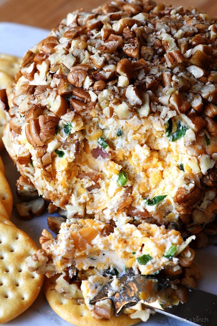 Bacon Ranch Cheese Ball Recipe - This creamy, dreamy cheese ball melds together bacon, ranch seasoning, and is the encased in chopped pecans. Perfect for easy entertaining! // addapinch.com