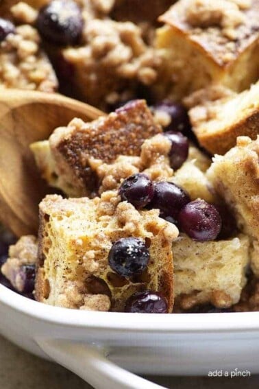 Baked Blueberry French Toast Recipe - This Baked Blueberry French Toast makes a delicious breakfast or brunch recipe! Made with bread, blueberries, maple syrup and topped with a streusel topping, this is always a favorite! // addapinch.com