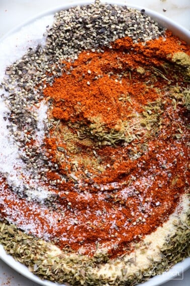 Photograph of ingredients for blackened seasoning in a white dish