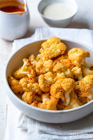 Photo of buffalo cauliflower in a white bowl.