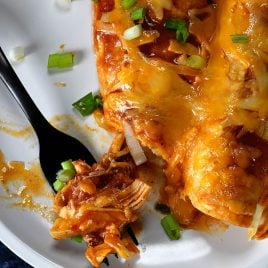 Buffalo Chicken Enchiladas Recipe - These quick and easy buffalo chicken enchiladas are so simple, yet scrumptious! Ready and on the table in 30 minutes! // addapinch.com