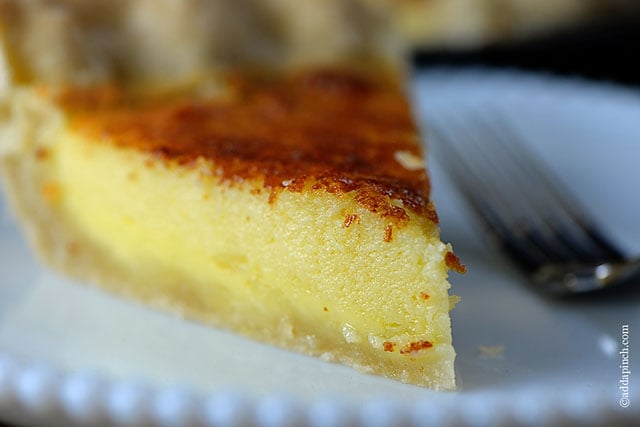 Slice of buttermilk pie on a white plate.