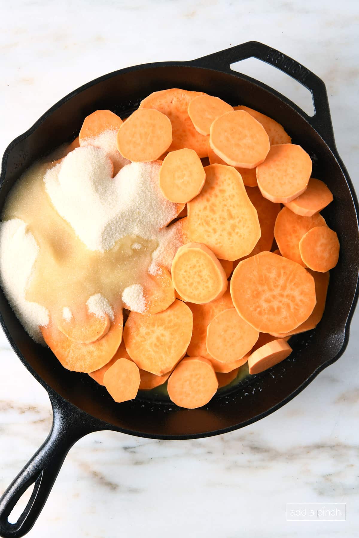 Ingredients for candied sweet potatoes in a skillet.