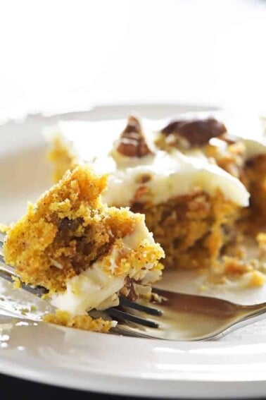 Easy Carrot Cake Sheet Cake Recipe - This Easy Carrot Cake Sheet Cake recipe comes together easily and bakes into a beautiful, delicious carrot cake! Topped with a fluffy cream cheese frosting, this carrot cake is one everyone asks for the recipe! // addapinch.com