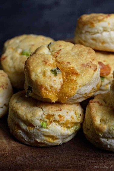 Cheddar Scallion Biscuits Recipe - Tender and delicious, these fluffy, cheesy cheddar scallion biscuits make the perfect addition to any meal and couldn't be easier! // addapinch.com