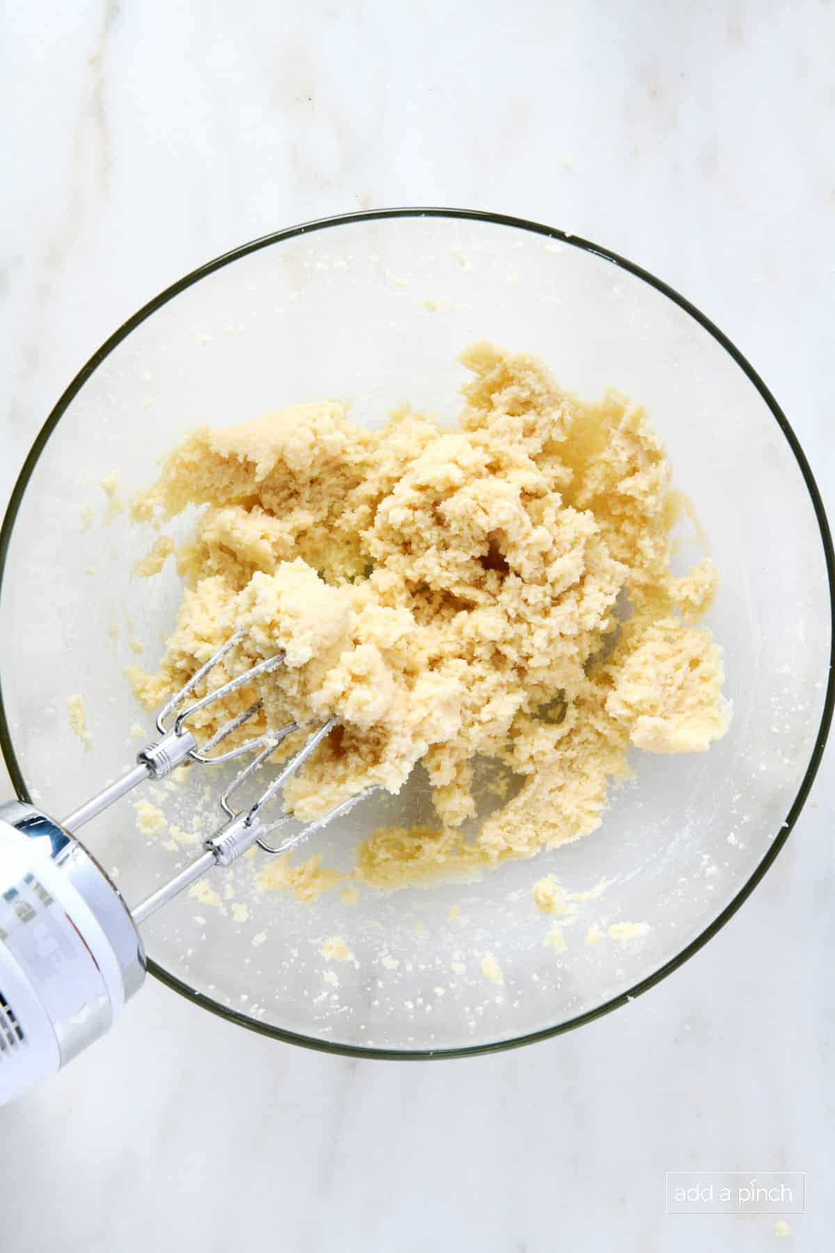 Creamed together butter and sugar in a glass mixing bowl.