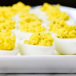 Deviled eggs make the perfect appetizer or side dish for family meals, parties, holidays, potlucks, picnics and more. This simple and classic deviled eggs recipe is a family favorite! // addapinch.com