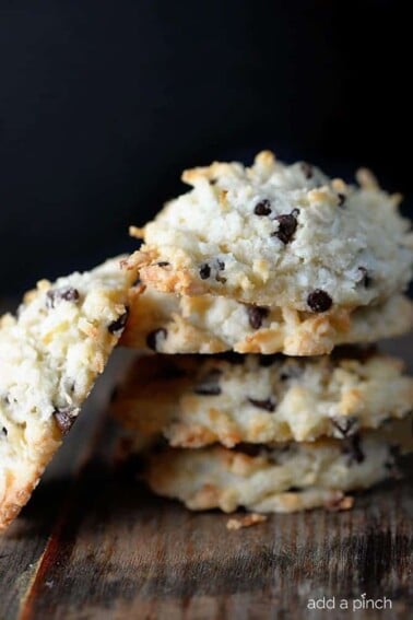 Coconut cookies make a for a favorite of holiday cookie recipes. These Coconut Dream Cookies are filled with mounds of coconut, chocolate, and use coconut oil. // addapinch.com