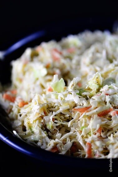 Coleslaw Recipe - A classic coleslaw recipe. Made of cabbage and topped with a delicious dressing, this coleslaw recipe is one you'll use again and again! // addapinch.com