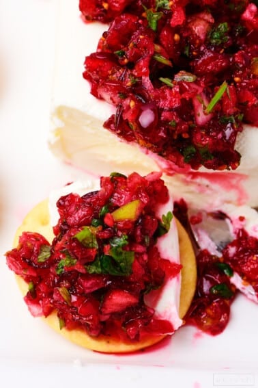 Closeup of cranberry salsa over cream cheese.