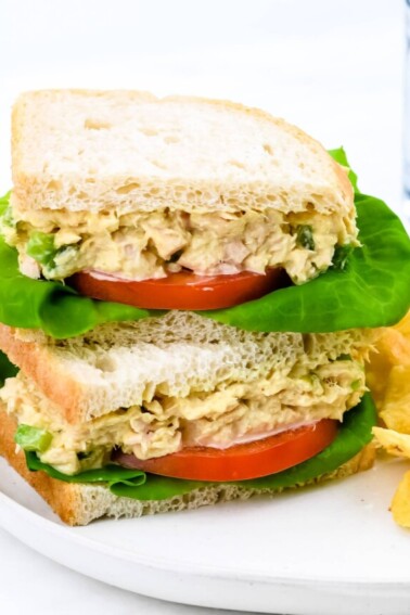 This tuna salad sandwich is so quick and easy and makes for a simple, yet scrumptious meal! Made with tuna, mayonnaise, and a few ingredients that make this the best tuna salad sandwich I've ever tasted! // addapinch.com