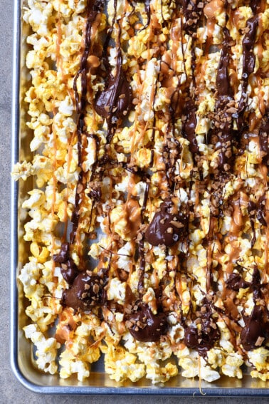 Caramel Crunch Popcorn Recipe - This quick and easy crunch popcorn recipe is perfect for the sweet and salty lover! Ready in minutes! // addapinch.com