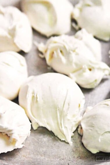 Photograph of white divinity candy on a silver plate.