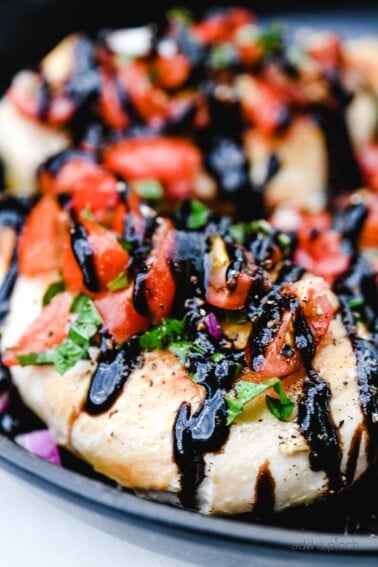 Easy Bruschetta Chicken Recipe with a rich balsamic glaze is delicious! Ready in less than 30 minutes, this easy chicken recipe is an all-time favorite! // addapinch.com