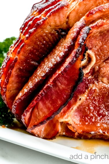 Cola Glazed Ham Recipe - This classic cola glazed ham recipe with brown sugar makes an easy baked ham perfect for any occasion!  // addapinch.com