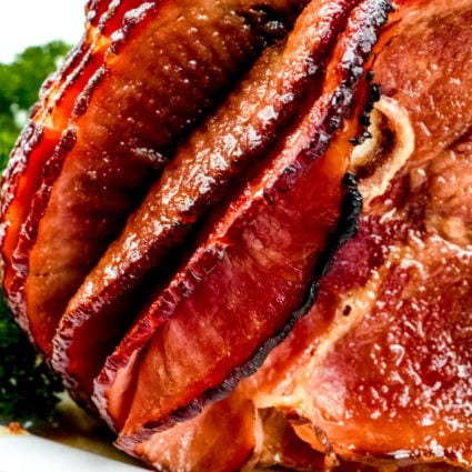 Cola Glazed Ham Recipe - This classic cola glazed ham recipe with brown sugar makes an easy baked ham perfect for any occasion!  // addapinch.com