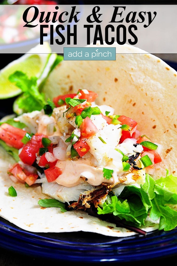 Fish Tacos with lime slice and text - addapinch.com