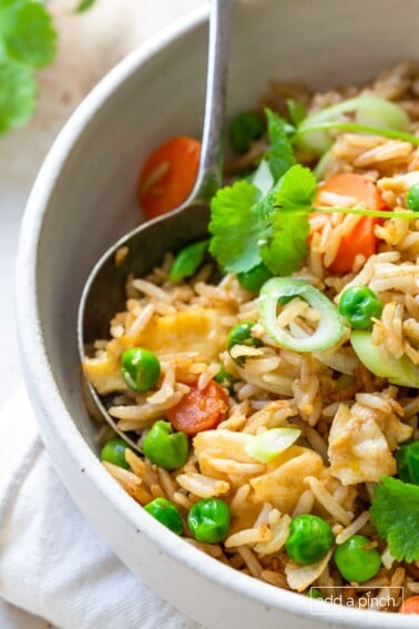 Photo of fried rice recipe in a white bowl.