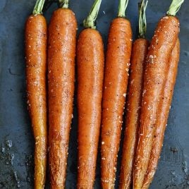 Garlic Roasted Carrots Recipe - Garlic Roasted Carrots recipe make a quick, easy and delicious carrot recipe! The perfect side dish for easy weeknights as well as when entertaining! // addapinch.com