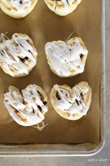 Heart-shaped Cinnamon Rolls Recipe - Heart-Shaped Cinnamon Roll Biscuits make a quick and easy recipe perfect for breakfast, brunch or dessert! All the flavor of a cinnamon roll with the simplicity of a biscuit! // addapinch.com