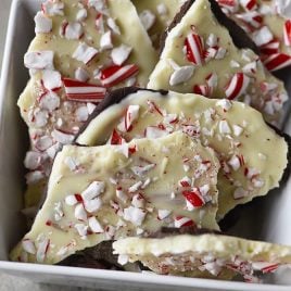 Homemade Peppermint Bark Recipe - Peppermint Bark makes a favorite holiday treat! This homemade peppermint bark recipe is made with layers of peppermint filled milk chocolate and white chocolate and then topped with peppermint candy. // addapinch.com