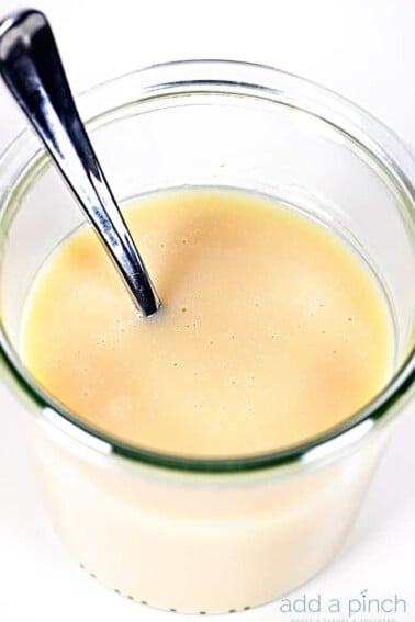 Homemade Sweetened Condensed Milk Recipe - This Homemade Sweetened Condensed Milk recipe makes a delicious, made from scratch version of sweetened condensed milk that you can use in coffee, baking, ice cream and more! // addapinch.com