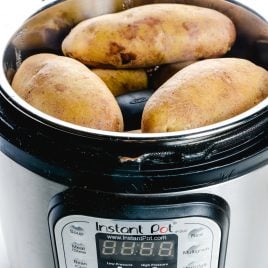 Instant Pot "Baked" Potatoes make a quick and easy way to prepare baked potatoes! Ready in less than 30 minutes! // addapinch.com