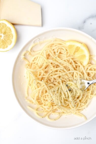 This Lemon Parmesan Pasta Recipe is a quick and easy pasta recipe that makes the perfect back pocket recipe for busy weeknights. Ready in less than 15 minutes! // addapinch.com