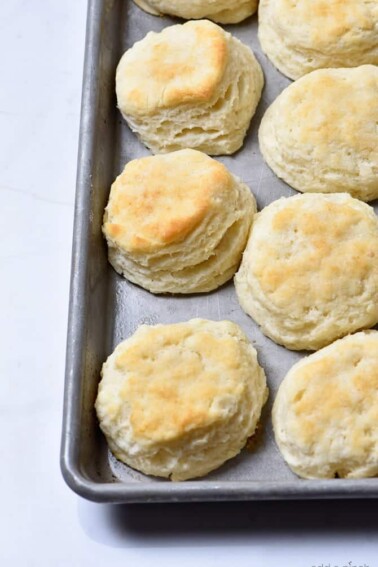 Make Ahead Biscuits Recipe - Make and bake biscuits ahead of time for quick and easy mornings! In less than 30 minutes, you'll have a week's worth of breakfast ready to grab, reheat and go! // addapinch.com