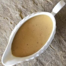 Make-Ahead Turkey Gravy Recipe - This easy turkey gravy recipe is essential to your holiday menu! Simple enough to make on the holiday, but perfect as a make ahead gravy recipe! // addapinch.com