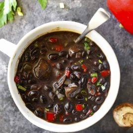 Red Pepper Mushroom Black Bean Soup Recipe - This quick and easy black bean soup recipe comes together in a snap for a vegetarian soup recipe that even meat lovers with adore! // addapinch.com