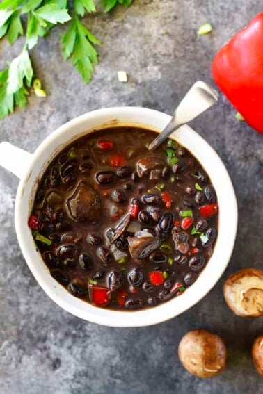 Red Pepper Mushroom Black Bean Soup Recipe - This quick and easy black bean soup recipe comes together in a snap for a vegetarian soup recipe that even meat lovers with adore! // addapinch.com