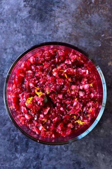 Orange Cranberry Salsa Recipe - Fresh cranberry salsa is a sweet fruit salsa recipe that adds color, flavor and wow to any dish! Perfect throughout the holidays! // addapinch.com