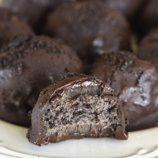 No Bake Oreo Truffles Recipe - These No Bake Oreo Truffles use just four ingredients and come together in a snap! Perfect to make throughout the year, but especially during the holidays! // addapinch.com