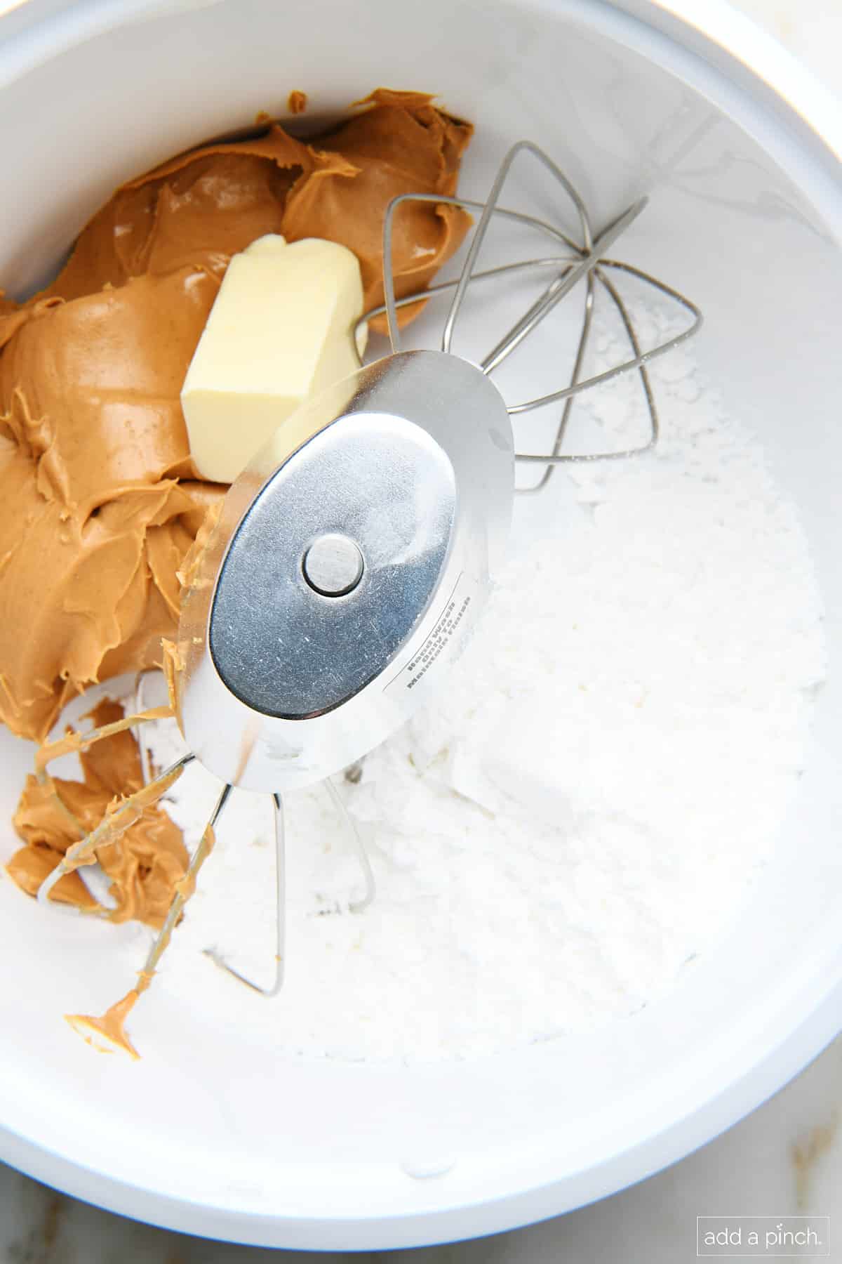 Ingredients in mixing bowl for peanut butter balls.