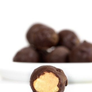 Peanut Butter Balls Recipe - the perfect combination of peanut butter and chocolate! This simple, no-bake recipe makes peanut butter balls everyone loves! // addapinch.com