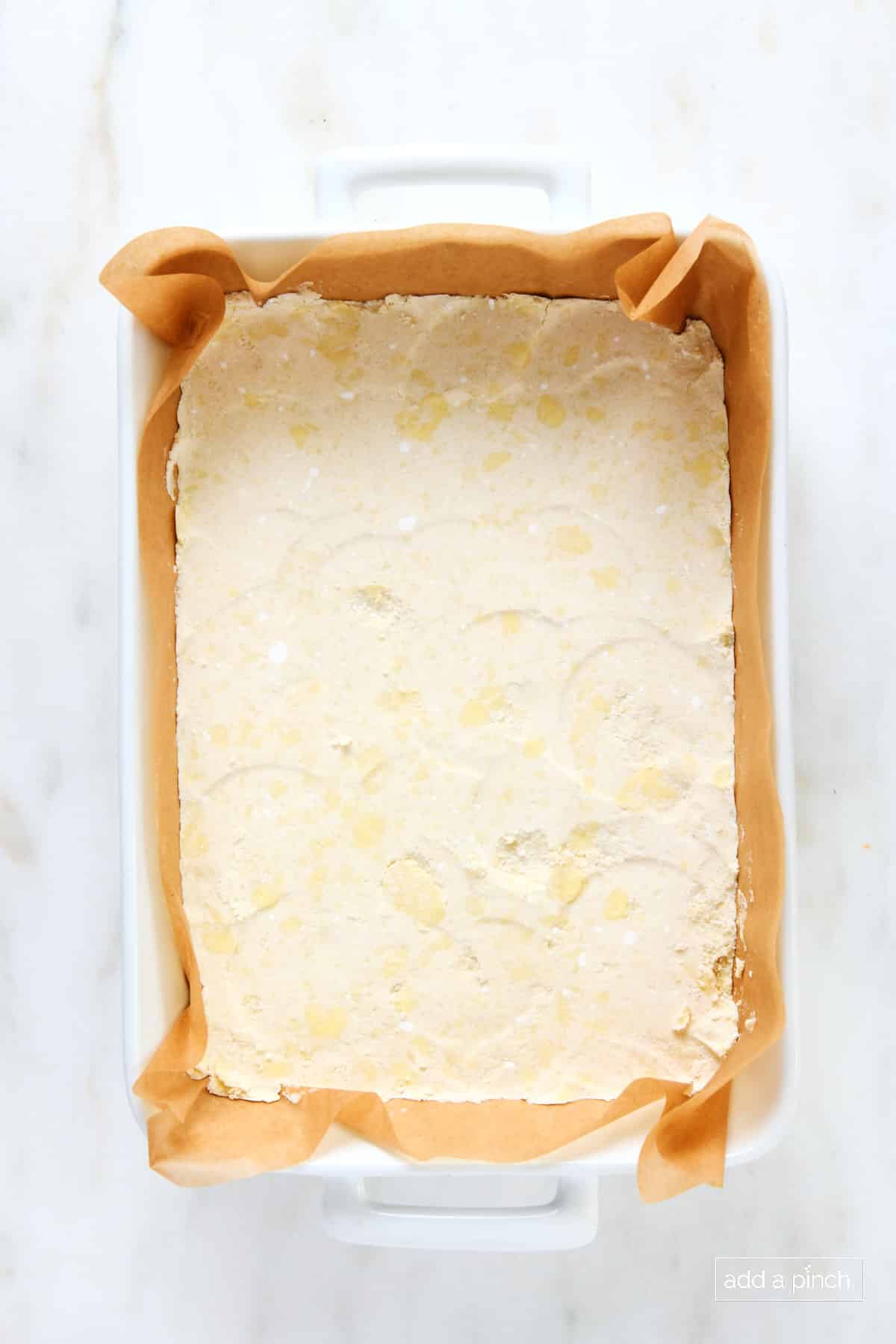 Shortbread crust in a 9x13 baking dish.