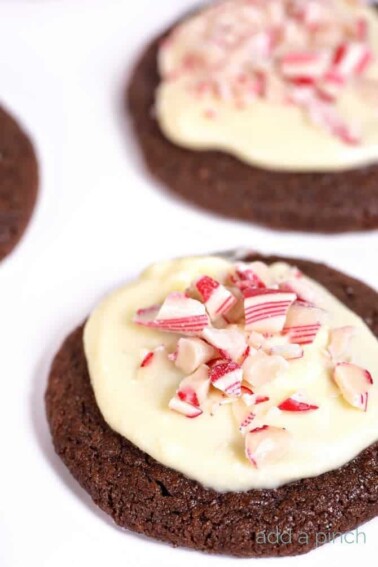 This Peppermint Bark Sugar Cookie recipe make for an easy favorite sugar cookie to serve throughout the holidays and winter! // addapinch.com