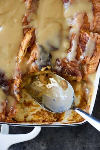 Pumpkin Bread Pudding Recipe with Maple Cream Sauce - This Pumpkin Bread Pudding is a decadent fall dessert! Top with Maple Cream Sauce for the best bread pudding -it tastes like pumpkin pie! Perfect dessert for the holidays and entertaining!! // addapinch.com