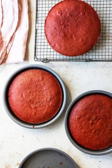 Cake layers ready to cool on a wire rack.