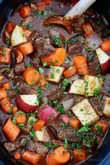 Slow Cooker Beef Bourguignon Recipe - A classic beef bourguignon recipe made easy in the slow cooker! Loaded with vegetables, beef, and a thick, rich sauce perfect for entertaining or busy weeknights! // addapinch.com