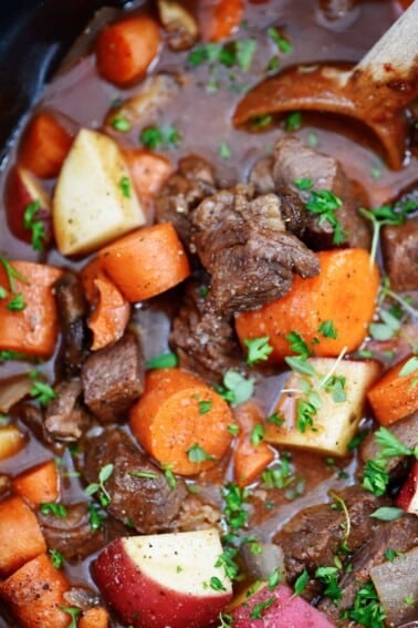 Slow Cooker Beef Bourguignon Recipe - A classic beef bourguignon recipe made easy in the slow cooker! Loaded with vegetables, beef, and a thick, rich sauce perfect for entertaining or busy weeknights! // addapinch.com