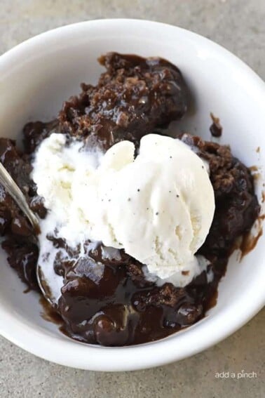 Southern Chocolate Cobbler Recipe - Chocolate Cobbler is a classic Southern dessert recipe. With a delicious brownie-like topping and a rich fudge sauce on the bottom, this Chocolate Cobbler is like a lava cake but so much easier to make. Great for reunions, potlucks, and more! // addapinch.com