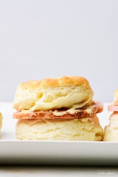 Southern ham biscuit with salty ham and honey butter spread.