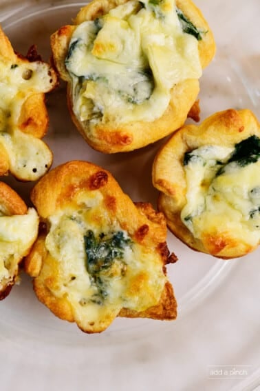 Plate of cheesy spinach dip bites.